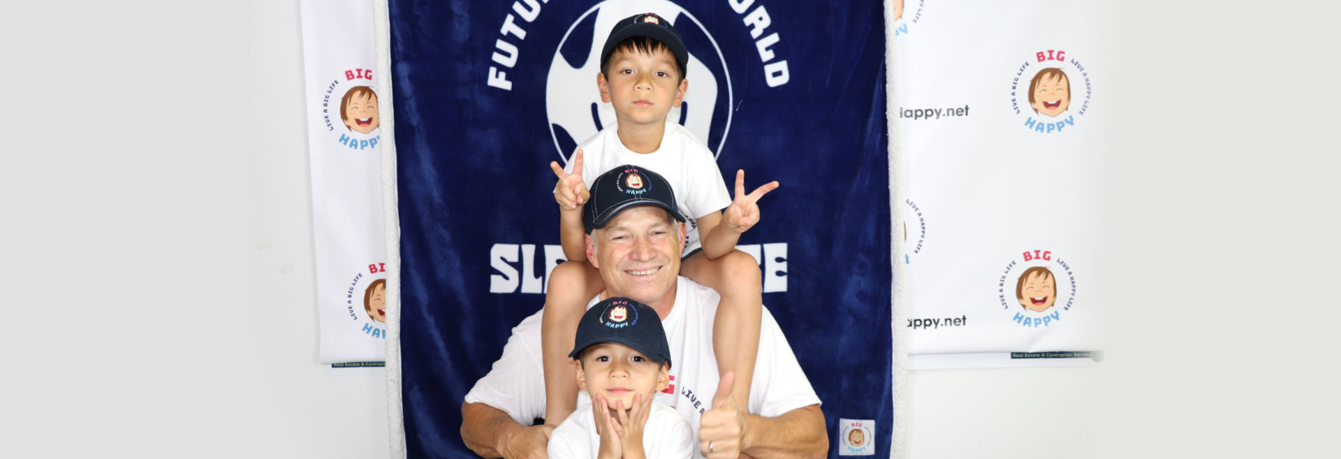 dad and sons taking a picture